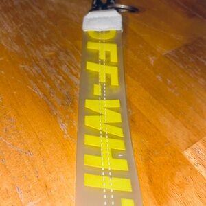 Off-White Keychain with Yellow Lettering
